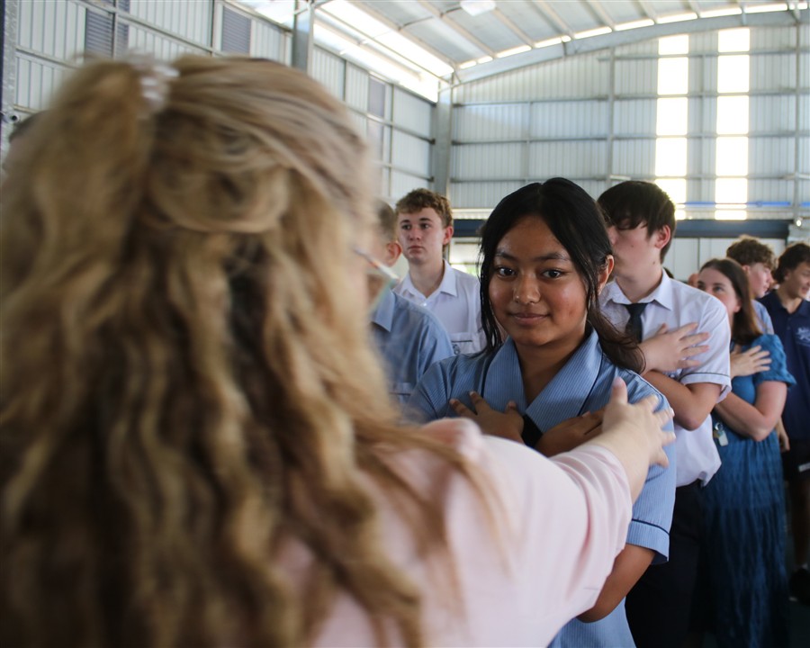 Student receiving a blessing for communion