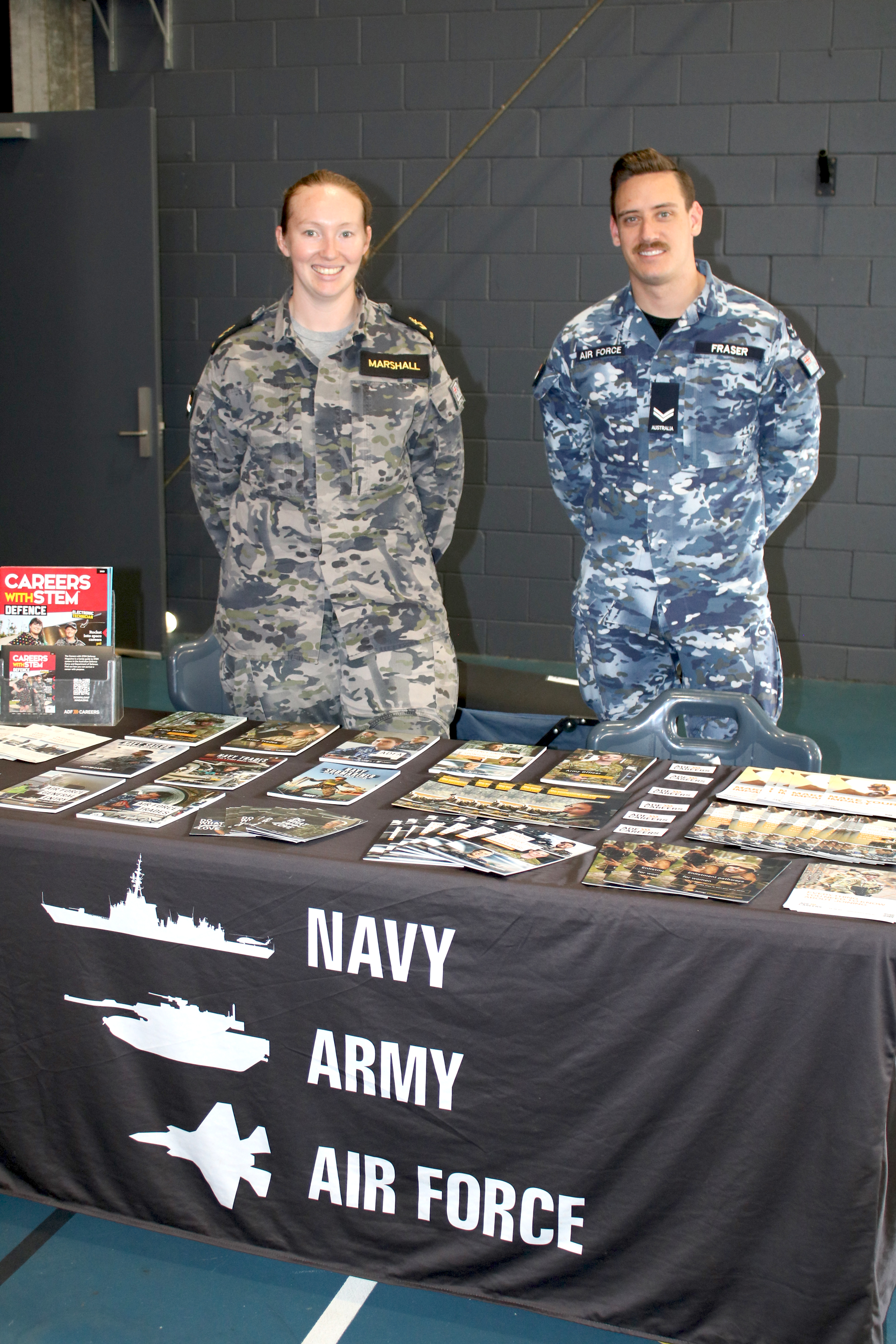 Career at Navy, Army, Air force. Two soldiers standing behind the desk