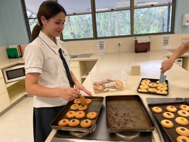 A girl is preparing cookies